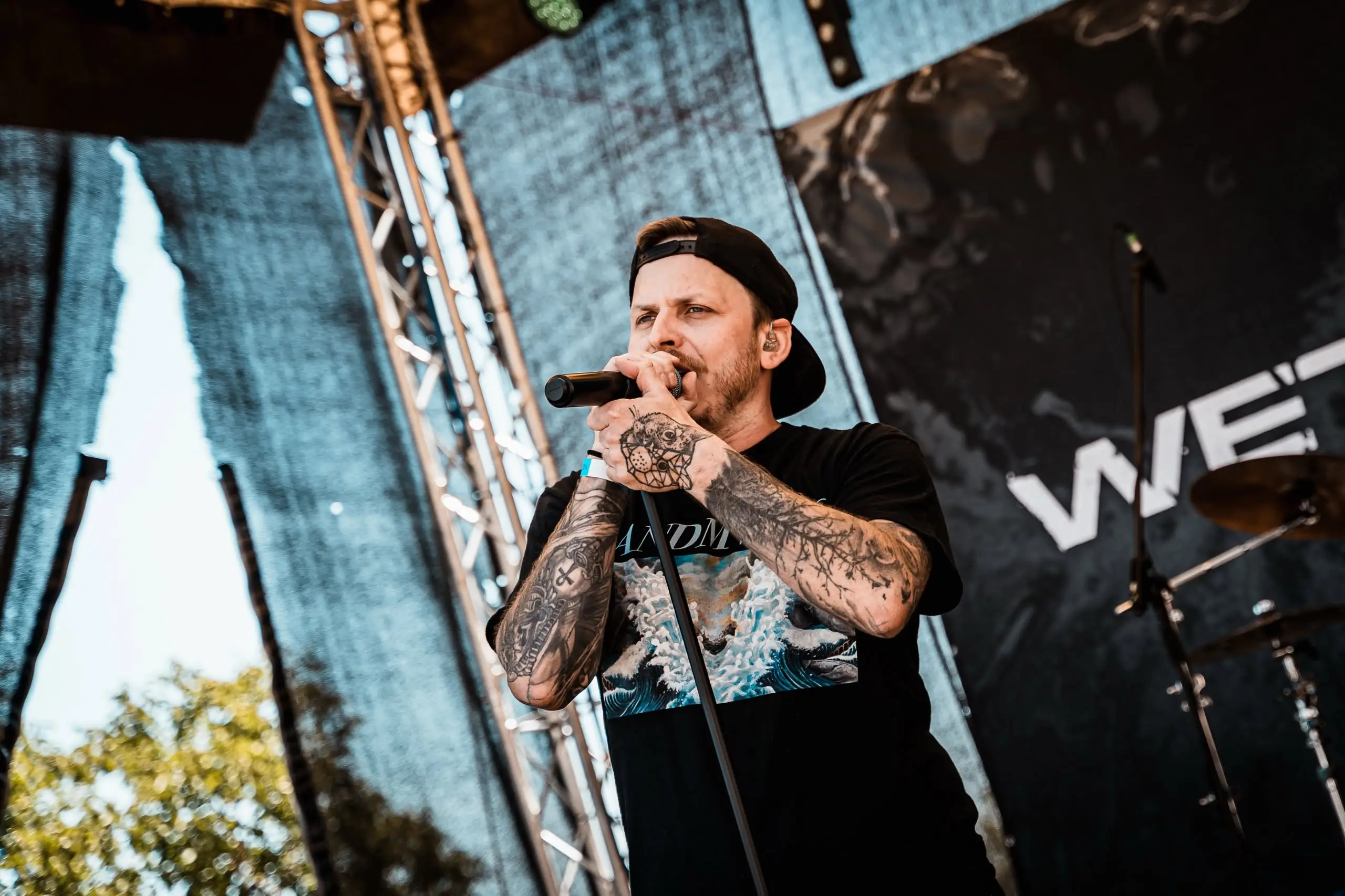 Vocalist singing on the open-air stage, Front Line Fest 2026